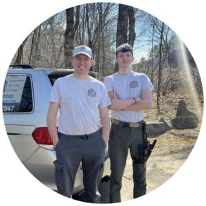 Father-son team from Handymasters Painting Co. standing in front of service vehicle, showcasing their commitment to local painting services in Seacoast NH.
